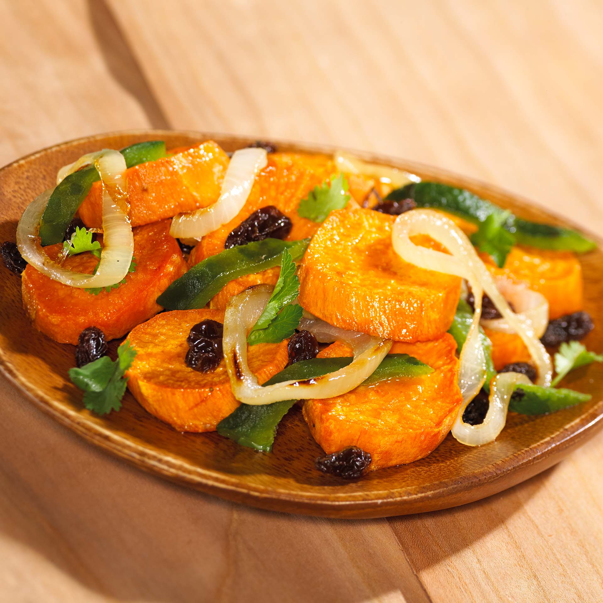 Sweet Potatoes with Raisins and Poblano Chile Rajas - California Raisins